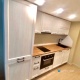Заказ УТ241. Белая кухня с двухсторонними фасадами под дерево